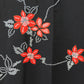 A women's habutae haori coat with a striking red flower pattern on a black background｜黒地に赤花が印象的な女物の羽二重羽織